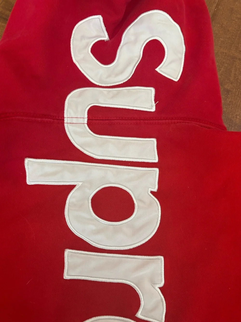 Supreme Red Hoodie with White Logo Tag